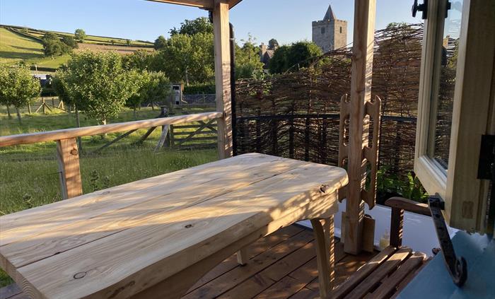 Enjoy outside meals and star gazing on covered deck area overlooking enchanting meadow.